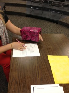 This box provides the student with a place to rest their hand while writing and also holds the corner of the paper down so it doesn't move while writing.