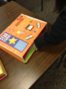 This box can be placed inside a desk to support a student that needs stimulation while seated in class.