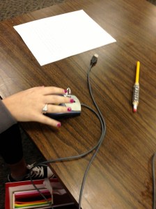 Computer mouse with ring attached to left click to support finger.